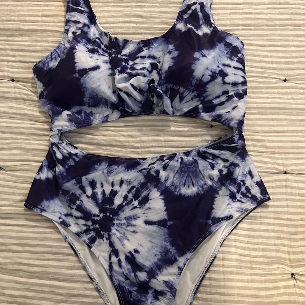 One piece bathing suit with back and front cut out
